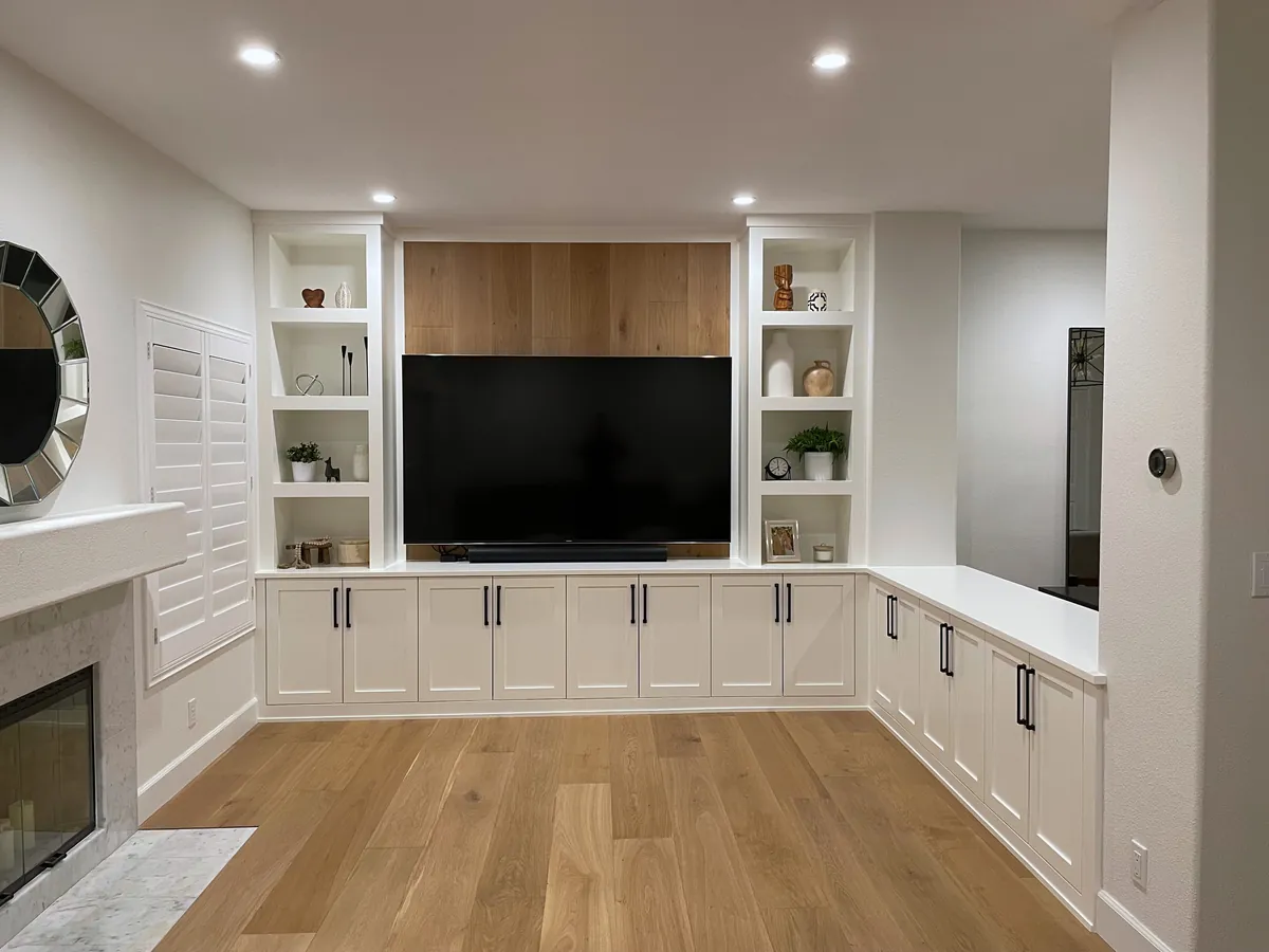 White media wall with open shelving, a wood feature panel and wrap-around base cabinets, Oak Park