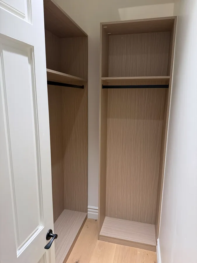Reach-in closet with two tall hanging sections, each with a rod and top shelf, Thousand Oaks