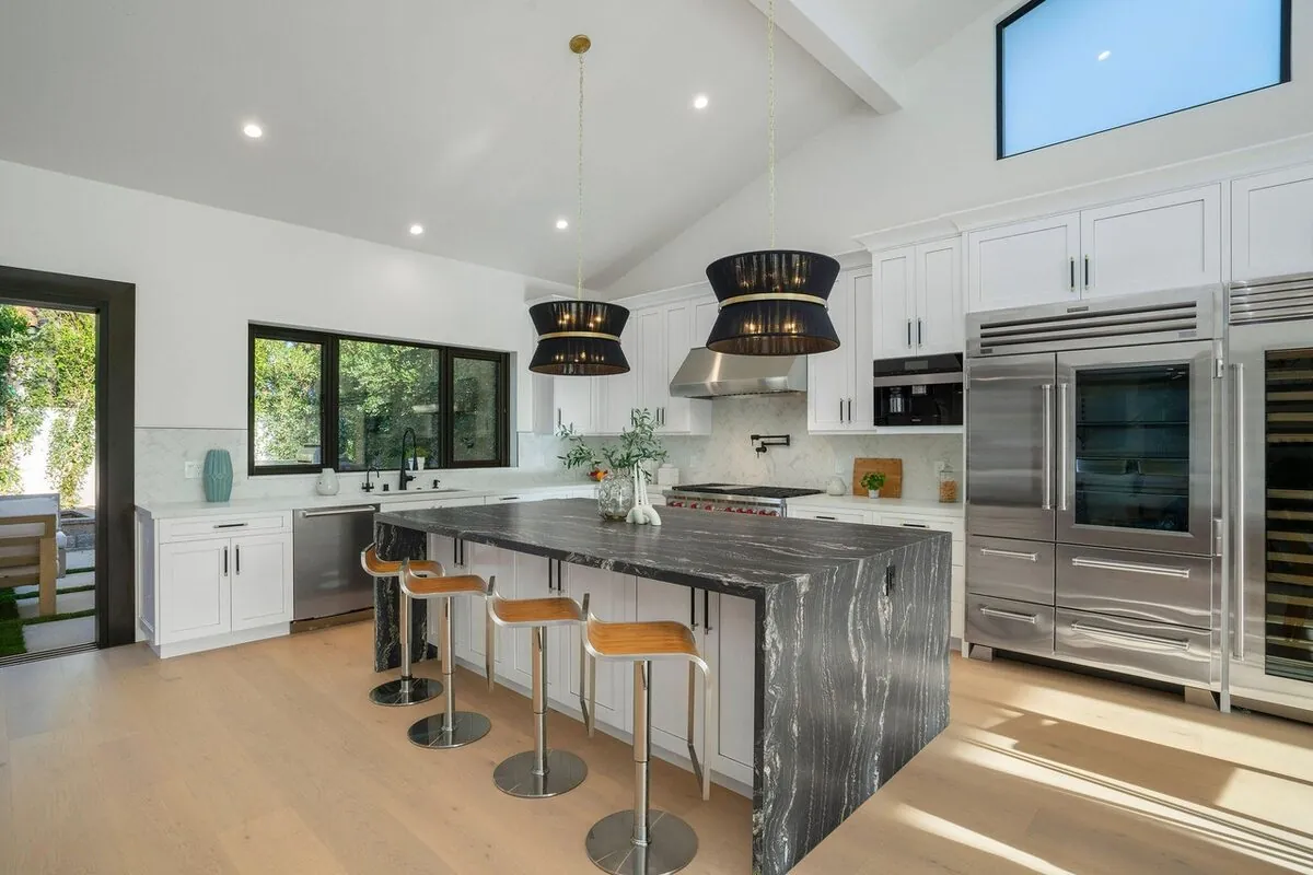 Vaulted Kitchen with Custom Cabinetry & Wine Wall