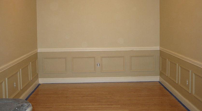 Custom Paint Grade Wainscoting and Crown Molding with a Swiss Coffee Lacquer Finish.