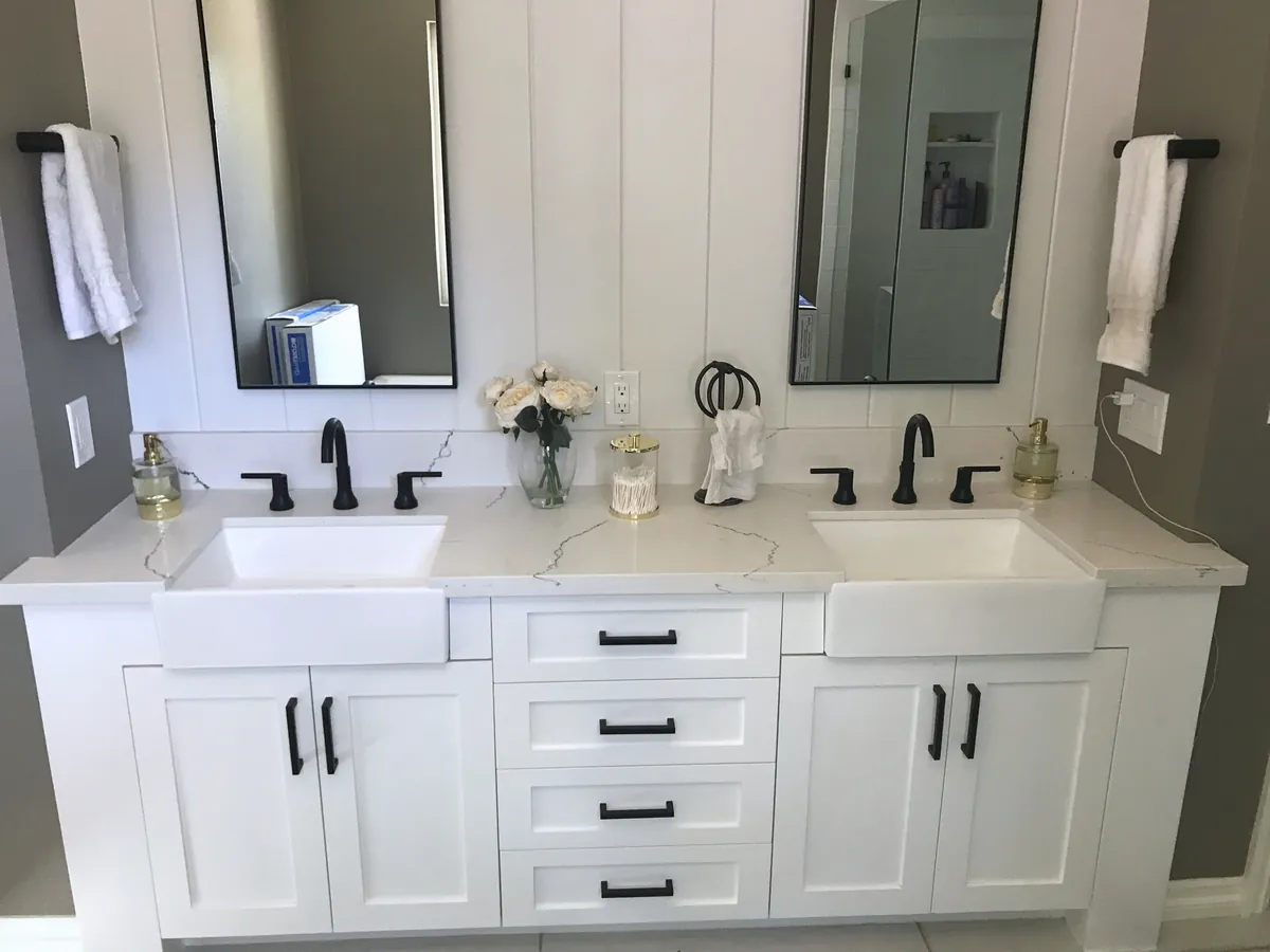 White shaker double vanity with black hardware