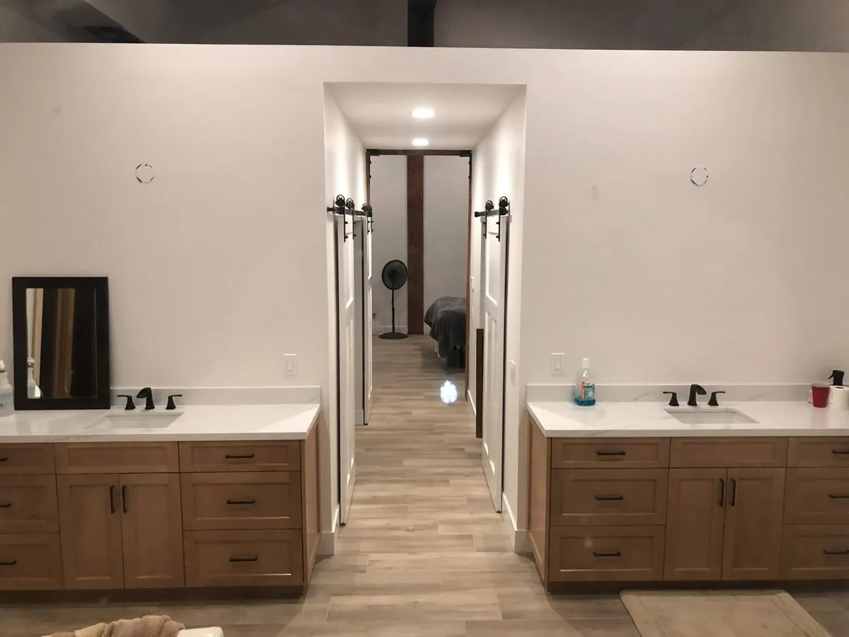 His & Hers Vanities with Barn Door