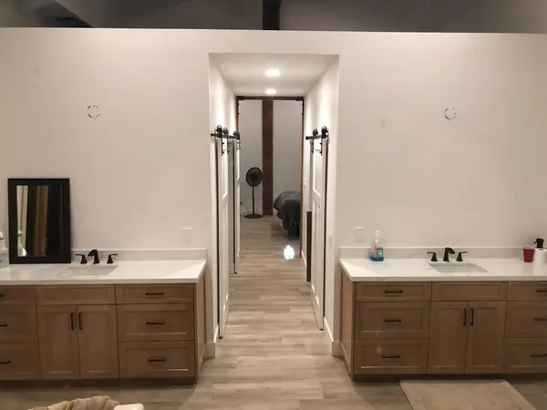 His & Hers Vanities with Barn Door