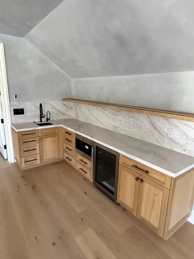 L-shaped oak wet bar with stone counters, Thousand Oaks